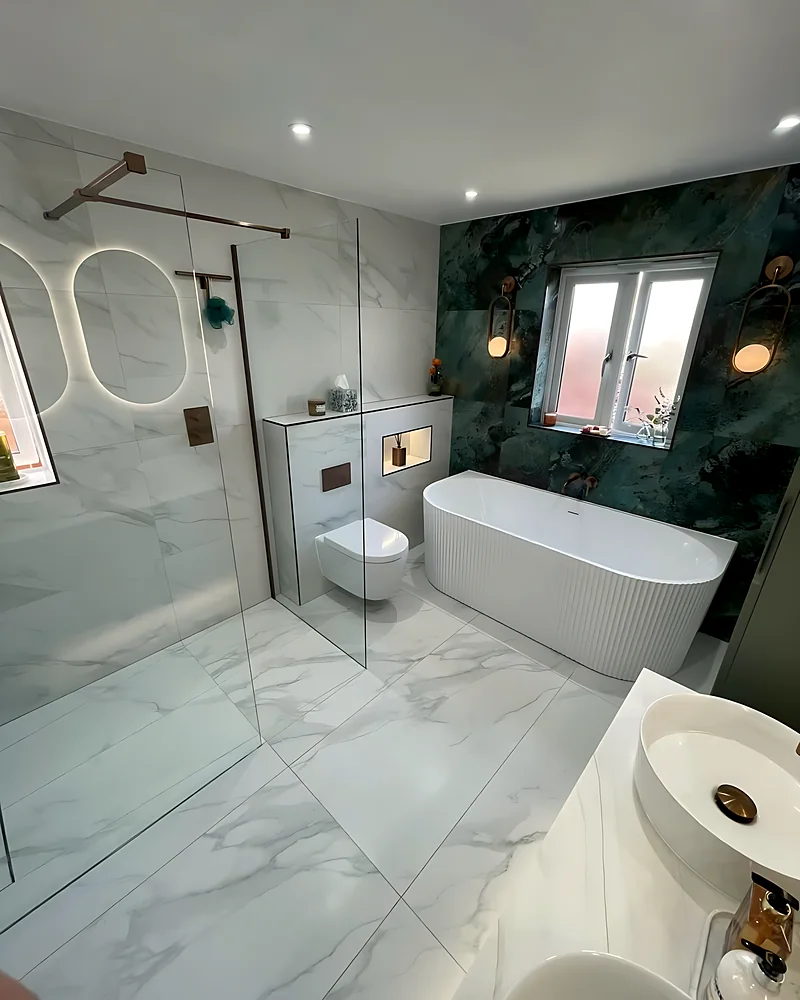 Shower area with a glass screen and a lit niche