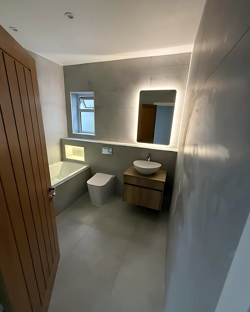 Basin and mirror beside the door
